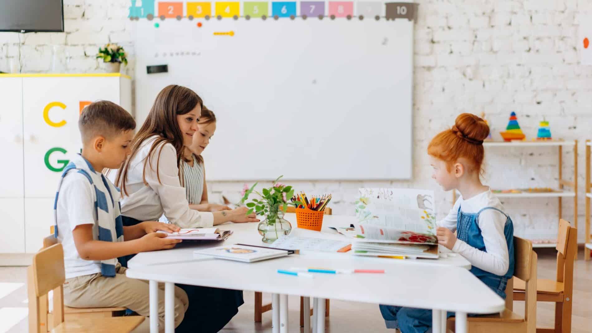 Students and teacher interacting in a bright, colorful classroom setting.